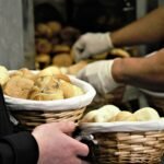 Close-up of fresh bread in woven baskets at a bakery. Perfect for food and business themes.